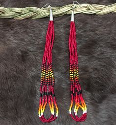 Authentic Beautiful Native American Indian Jewelry Navajo Hand Beaded Long Dangle Earrings. Great for a gift❤️ Handcrafted by Navajo Artist R. Sellers These beautiful earrings are 7.75" in length and 1" in width. Southwestern Dangling Beads For Jewelry Making, Southwestern Style Beaded Earrings For Festival, Southwestern Style Handwoven Dangle Jewelry, Navajo Earrings Beaded, Red Southwestern Style Earrings With Round Beads, Southwestern Teardrop Beaded Earrings, Southwestern Style Red Round Bead Earrings, Adjustable Southwestern Beaded Earrings, Southwestern Red Beaded Earrings With Dangling Beads