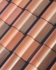 a close up view of the top of a roof with many different colored shingles