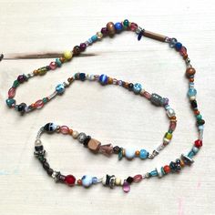 One Of A Kind Handmade Glass Bead Necklace With Vintage Y2k + 90s Beads Featuring: Vintage, Y2k/90s + Modern Beads Glass, Wood, Turquoise, Clay, Few Vinyl/Acrylic Curated Blend Of Small + X-Small Beads Chunk Scale Of 1 To 5: 1.2 Fine Quality Knotted Durable High Tenacity Nylon Cord 14.75” Drop Length 29” Total Length Brand: Www.Karlymortensen.Com Vintage + New Materials Handmade In Denver, Colorado Ready To Ship Featured With Daisy Vs Daisy Earrings - This Listing Is For Necklace Only Shop My Bo Funky Beaded Jewelry For Festivals, Artsy Colorful Beaded Necklaces For Festivals, Bohemian Glass Beaded Necklaces With Wooden Beads, Bohemian Glass Beaded Necklace With Wooden Beads, Bohemian Beaded Necklaces With Large Beads For Everyday, Everyday Handmade Glass Necklaces, Spiritual Glass Beaded Festival Necklaces, Spiritual Glass Beaded Necklaces For Festivals, Spiritual Glass Beaded Necklace For Festivals