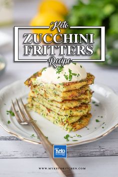 a stack of zucchini fritters on a white plate with a fork