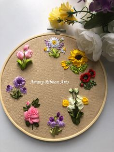 an embroidery project with flowers and the words art today on it