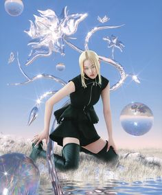 a woman in black dress and boots sitting on the ground next to water with bubbles