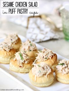 some chicken salad in puff pastry cups on a white plate