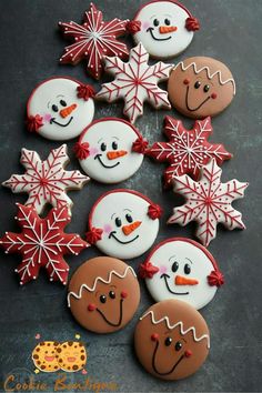 decorated cookies are arranged in the shape of snowmen