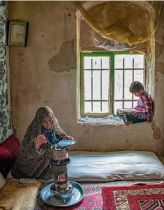 two children sitting on a bed looking out the window