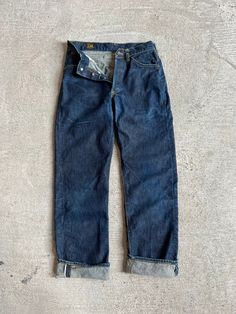 1950s Dark Wash Lee Riders. Selvedge. Good vintage condition. Minor wear on back of leg.  Measurements flat:  27" Waist  11" Rise  37" Hip  29.5" Inseam All sales final, please ask any questions you have before buying. Thanks! Vintage Bottoms With Pockets And Straight Hem, Vintage Jeans With Button Closure For Work, Vintage Selvedge Jeans With Standard Cut Leg, Vintage Selvedge Jeans With Standard Cut, Vintage Tapered Leg Jeans For Workwear, Vintage Straight Leg Jeans With Button Closure, Vintage Tapered Leg Jeans With Belt Loops, Vintage Fitted Jeans With Button Closure, Vintage Selvedge Standard Cut Jeans