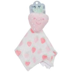 a pink and white baby blanket with a smiling strawberry on the front, it is attached to