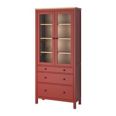 a tall red cabinet with glass doors on the top and bottom drawers, in front of a white background