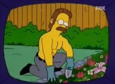 the simpsons is sitting on the ground in front of a tv screen with flowers and plants