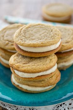 cookies with white frosting on a blue plate