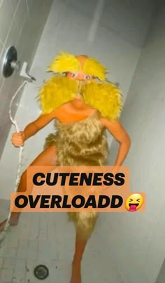 a woman in a chicken costume standing next to a shower with the words cutness overload on it