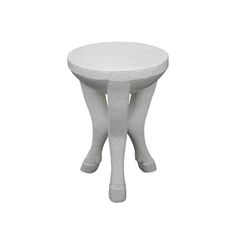 a small white stool with legs on it