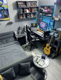 a living room filled with furniture and lots of shelves on the wall next to a guitar