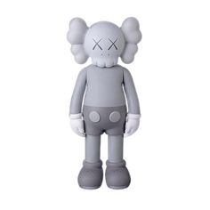 an inflatable toy is standing on a white surface with one eye open and two ears closed