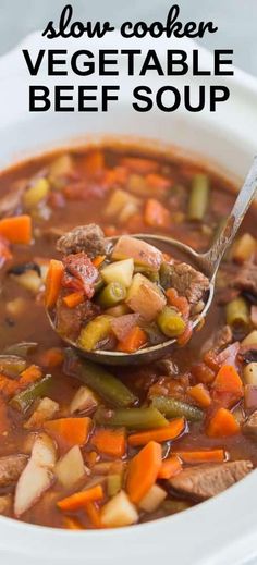 slow cooker vegetable beef soup in a white bowl with a ladle full of the soup