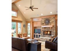 a living room filled with furniture and a fire place