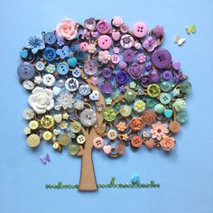 a tree made out of buttons on a blue background