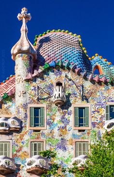 an ornate building with colorful tiles and windows