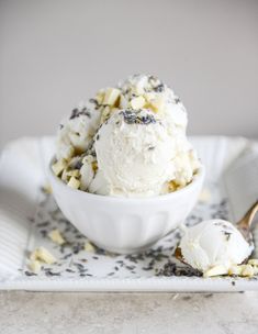 two scoops of ice cream on a white plate