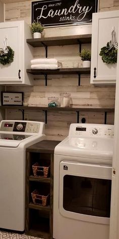 a white washer and dryer sitting in a laundry room next to each other