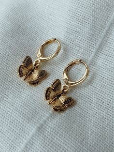 18K Gold filled butterfly.  14K gold  filled huggies (will not tarnish easily) 14k Gold Butterfly Charm Earrings, 14k Gold Butterfly Earrings With Butterfly Charm, 14k Gold Butterfly Earrings With Charm, 14k Gold Butterfly Earrings For Gift, Everyday Gold Butterfly-shaped Jewelry, Dainty Yellow Gold Earrings With Butterfly Charm, 14k Yellow Gold Earrings With Butterfly Charm, Butterfly Charm Huggie Earrings For Gifts, Dangle Hoop Earrings With Butterfly Charm As A Gift