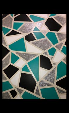 an abstract mosaic design with black, white and teal colors is featured in this photo