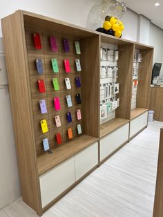 a display case with many different colored phones on it's sides in a store