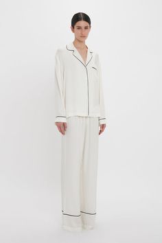 Exquisitely cut from tactile 100% silk, the Pyjama Sleep Set in nostalgic Ivory is an elevated sleepwear and loungewear option. An all-over VB house monogram print imbues the co-ord with its distinct personality, while the luxurious fabrication ensures comfort and ease of movement. The set comes with a tote bag and eye mask in a matching print. Victoria Beckham VB Monogram Pyjama Sleep Set In Ivory  - Size L UK Monogrammed Pajamas, Monogram Prints, Sleep Set, Sleepwear & Loungewear, Co Ord, Outfits Ideas, Victoria Beckham, Eye Mask, Lounge Wear