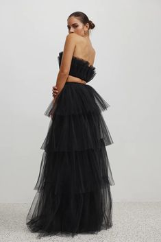 The Lorena Set is crafted from layers of tulle that have been pleated and gathered creating the most exquisite statement look. The skirt features four tiers of tulle and a dramatic, sexy, thigh high split on the left hand side. The skirt is inbuilt with a body suit, for ultimate comfort and practicality, and paired with a satin band to define the waist. The top and skirt both fasten at the back with zippers. Features: Two piece set with floor length skirt and thigh high split Strapless bodice wi Skirt And Thigh Highs, Tiered Tulle Skirt, Floor Length Skirt, Fashion Event, Style Gift, Body Suit, Thigh High, Thigh Highs, Left Hand