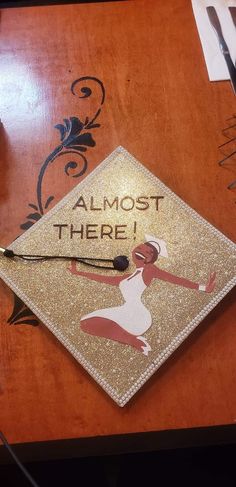 a graduation cap with the words almost there on it and an image of a woman