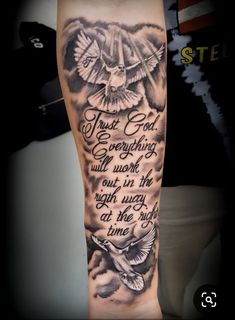 an arm with a quote on it that says trust god everything will work out in the night