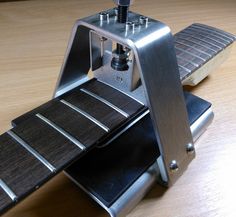 a metal object sitting on top of a wooden table