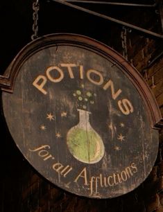 a sign hanging from the side of a brick building that says rotton's total africtors