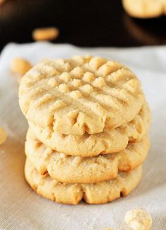 a stack of cookies sitting on top of a white napkin