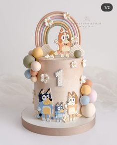 a cake decorated with cartoon characters and decorations