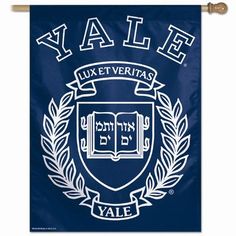 a blue banner hanging on a wooden wall with the words fraternity and laurels in white