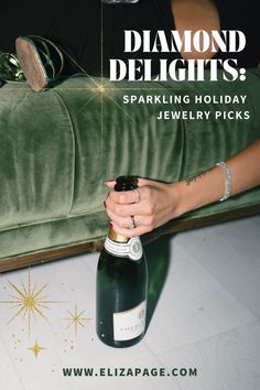 a woman holding a bottle of sparkling holiday jewelry picks in front of a green velvet couch