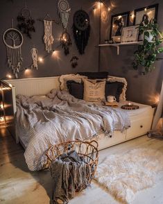 a bed room with a neatly made bed and lots of decorations on the wall above it