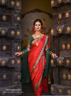 a woman in a red and green sari