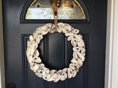 a wreath is hanging on the front door