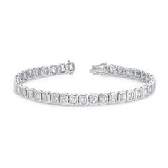 Design This tennis bracelet features vertically set emerald cut diamonds in a handmade bezel mounting. Details & Dimensions - 5.8 carats total (0.15 carats each diamond) - 6.5" length - G color, VS-SI clarity - Custom lengths and sizes available upon request. Email concierge@carbonandhyde.com. Classic Emerald Cut Baguette Diamond Tennis Bracelet, Classic Emerald Cut Diamond Bracelet With Accents, Timeless Emerald Cut Diamond Bracelet With Baguette Diamonds, Emerald Cut Tennis Bracelet With Diamond Accents, Emerald Cut Diamond Accents Tennis Bracelet, Timeless Emerald Cut Baguette Diamond Bracelet, Timeless Emerald-cut Baguette Diamond Bracelet, Formal Emerald Cut Diamond Bracelet With Single Cut Diamonds, Classic Rectangular Tennis Bracelet With Brilliant Cut