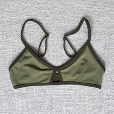 Reversible bikini top! Very comfortable for training and surfing Color - Military Green 80% - Nylon 20% - Lycra Handwash cold separately Do not wring or twist Do not dry on the sun Bottoms - https://www.etsy.com/listing/1250164300/women-swimwear-surf-pole-dance Check the size chart in photo gallery Our sizing is based on a true and snug fit. When deciding on what is the best for you, think about how tight you would like your swimwear to fit.  For all in-between sizes, or if you can not decide on Casual Nylon Swimwear With Bra-friendly Design, Sporty Triangle Top Swimwear In Solid Color, Sporty Solid Color Triangle Top Swimwear, Nylon Athleisure Sports Bra, Sporty Solid Swimwear With Padded Cups, Sporty Triangle Top Sports Bra For Beach, Sporty Padded Swimwear For Workout, Bra Friendly Green Swimwear For Workout, Sporty Nylon Swimwear With Padded Cups