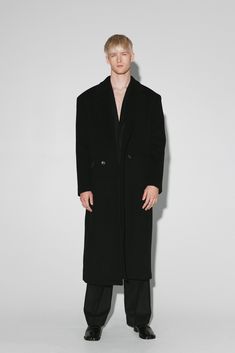 Traditional Wall Street menswear meets west coast casual. Blending precise tailoring with an effortless, oversized silhouette, this supremely relaxed statement coat features broad, padded shoulders, a double breasted front closure and notch lapels. Named after Manhattan Beach in the South Bay, this versatile overcoat works with Tabis, sandals and socks or sneakers for an elevated, everyday luxury. Oversized Business Outerwear With Notch Lapel, Oversized Notch Lapel Outerwear With Double Button Closure, Oversized Outerwear With Double Button And Notch Lapel, Oversized Luxury Outerwear For Formal Occasions, Oversized Notch Lapel Pea Coat For Formal Occasions, Formal Oversized Pea Coat With Notch Lapel, Oversized Notch Lapel Pea Coat For Business, Oversized Business Pea Coat With Notch Lapel, Oversized Long Pea Coat For Formal Occasions