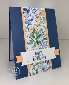 a blue and yellow birthday card with flowers on it