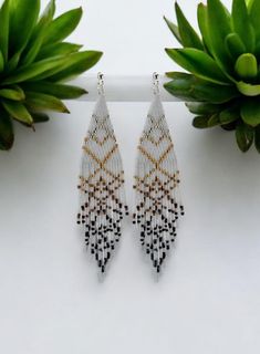 These abstract white bead dangle earrings are a perfect blend of modern design and minimalist elegance. Handcrafted with attention to detail, they offer a unique statement that effortlessly complements any outfit. The sleek white beads add a touch of sophistication, while the abstract design makes them stand out as a true piece of art. Ideal for both casual and formal occasions, these earrings are versatile and stylish. Whether you're treating yourself or looking for a unique gift, these handmad Handmade Modern, Beaded Dangle Earrings, White Beads, Beaded Dangles, Jewelry Earrings Hoops, Minimalist Jewelry, Statement Earrings, Women's Earrings, Unique Gifts