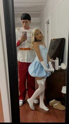 a man and woman dressed up in costumes