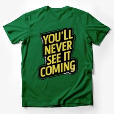 You'll Never See It Coming T-Shirt, Bold Text Graphic Tee, Urban Streetwear, Hip Hop Style Shirt, Unisex Fashion Top Male T-Shirt Custom graphic T-Shirt.Customize your color Graphic Tee With Slogan For Fan Merchandise, Fan Merchandise Slogan Graphic Tee, Green Crew Neck T-shirt With Text Print, Funny Green T-shirt With Slogan, Funny Green Tops With Letter Print, Cotton Slogan T-shirt For Fans, Cotton Slogan T-shirt Fan Apparel, Cotton Slogan T-shirt For Fan Apparel, Cotton Fan Apparel T-shirt With Slogan