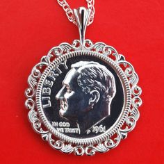 You are looking at a gorgeous solid 925 sterling silver necklace with an authentic US 1961 Roosevelt dime 90% silver BU Uncirculated Proof coin. The coin is set with backside 4-prong. The pendant is made of solid 925 sterling silver, sized about 29mm(1.16") x 23mm(0.92"). It comes with a 18" solid 925 sterling silver chain, and also a gift box. I hope you end up with one of these beautiful coin necklaces. This necklace will be great for gift, investment purpose or just adding to your coin/jewelr Nickel-free Sterling Silver Elegant Coin Necklace, Cheap Nickel-free Silver Coin Necklace, Nickel-free Sterling Silver Round Coin Necklace, Nickel-free Sterling Silver Coin Necklace As Gift, Photo Macro, Antique Nickel-free Silver Coin Necklace, Proof Coins, Cuff Bangle Bracelet, Coin Jewelry