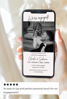 a person holding up a cell phone with the text we're engaged on it