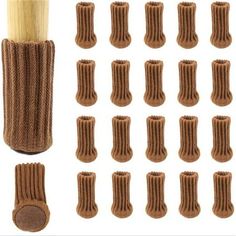 several pairs of brown knitted socks next to a wooden stick and some smaller ones